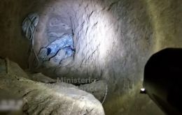 Investigators described the tunnel as a purpose-built connection between the storefront and the sewer network, allowing the group to move underground toward its target